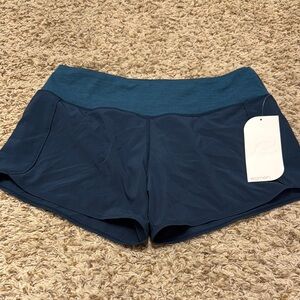 NWT. Roadrunner Women's Blue Athletic Shorts. Size M